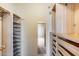 A spacious closet with shelving and pull-out storage drawers at 7217 S Hazelton Ln, Tempe, AZ 85283