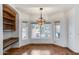 Inviting dining area with bay windows, custom lighting, and a built-in serving station at 7217 S Hazelton Ln, Tempe, AZ 85283