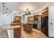 Spacious kitchen with granite countertops, a central island, and stainless steel appliances at 7217 S Hazelton Ln, Tempe, AZ 85283
