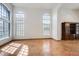 Bright, open living room with large arched windows, high ceilings, and an elegant built-in cabinet at 7217 S Hazelton Ln, Tempe, AZ 85283
