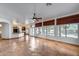 Open floor plan with living area, kitchen, and backyard access through glass doors at 7217 S Hazelton Ln, Tempe, AZ 85283