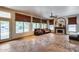 Open-concept living room featuring a fireplace, large windows, and cozy seating at 7217 S Hazelton Ln, Tempe, AZ 85283