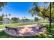 Community park overlooking the lake complete with benches and walking path at 7217 S Hazelton Ln, Tempe, AZ 85283