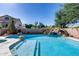 Refreshing swimming pool with rock waterfall, spa, and lush landscaping, perfect for relaxation and recreation at 7217 S Hazelton Ln, Tempe, AZ 85283