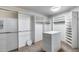 Walk-in closet with custom shelving, storage and bright lighting at 7217 S Hazelton Ln, Tempe, AZ 85283