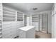 Walk-in closet with custom organizers and shelving at 7217 S Hazelton Ln, Tempe, AZ 85283