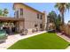 Spacious backyard features manicured lawn and patio area at 7512 W Tonto Dr, Glendale, AZ 85308