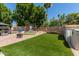 This backyard features a large artificial turf area and a golf net at 7512 W Tonto Dr, Glendale, AZ 85308