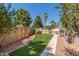 Beautiful backyard featuring lush turf and mature trees at 7512 W Tonto Dr, Glendale, AZ 85308