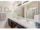 Well-lit bathroom with double sinks and ample counter space at 7512 W Tonto Dr, Glendale, AZ 85308