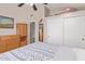 Cozy bedroom features a closet, wooden dresser, carpet and shelf for storage at 7512 W Tonto Dr, Glendale, AZ 85308