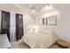 Bright bedroom with a queen-sized bed and neutral decor at 7512 W Tonto Dr, Glendale, AZ 85308