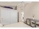 Bedroom with closet and view into the bathroom at 7512 W Tonto Dr, Glendale, AZ 85308