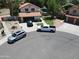 Aerial view of a two-story home with a well-maintained yard and a three-car driveway at 7512 W Tonto Dr, Glendale, AZ 85308