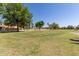 This golf course features lush green grass and trees at 7512 W Tonto Dr, Glendale, AZ 85308