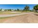 A curving sidewalk leads through the lush green golf course, perfect for an active lifestyle at 7512 W Tonto Dr, Glendale, AZ 85308