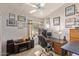 Home office with a work desk, comfortable chair, and ample lighting at 7512 W Tonto Dr, Glendale, AZ 85308