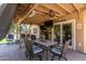 Outdoor patio features a ceiling fan, furniture, tv, and stone flooring at 7512 W Tonto Dr, Glendale, AZ 85308