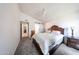 Comfortable bedroom with a ceiling fan and plenty of closet space at 8521 W Mauna Loa Ln, Peoria, AZ 85381