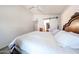 Clean bedroom showcases a ceiling fan, storage, and closet with barn door at 8521 W Mauna Loa Ln, Peoria, AZ 85381