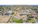Bird's-eye view of homes in a community with desert landscape, mountain views, and solar panels at 8767 W Villa Hermosa --, Peoria, AZ 85383
