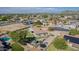 Expansive aerial view of a residential community featuring single-Gathering homes with desert landscaping and mountain views at 8767 W Villa Hermosa --, Peoria, AZ 85383