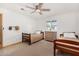 Bright bedroom with two beds, natural light, and wood floors and trim at 8767 W Villa Hermosa --, Peoria, AZ 85383
