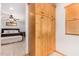 View of bedroom with bed and door to bathroom with large cabinet and window with blinds at 8767 W Villa Hermosa --, Peoria, AZ 85383