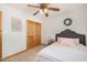 Comfortable bedroom featuring stylish furnishings, a ceiling fan, and a wood closet at 8767 W Villa Hermosa --, Peoria, AZ 85383