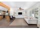 Living room featuring built-in shelving, an exposed beam and tile floors at 8767 W Villa Hermosa --, Peoria, AZ 85383