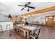 Spacious living and kitchen area features hardwood floors and a wooden dining table at 8767 W Villa Hermosa --, Peoria, AZ 85383