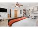 Main bedroom with a leather bed frame, ceiling fan, and ensuite bathroom access at 8767 W Villa Hermosa --, Peoria, AZ 85383