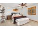 Spacious main bedroom with a leather bed frame, tile floors, and a ceiling fan at 8767 W Villa Hermosa --, Peoria, AZ 85383