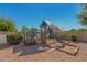 Backyard with a playground and a small playhouse under a clear blue sky at 8767 W Villa Hermosa --, Peoria, AZ 85383