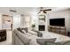 Inviting living room featuring a large sectional sofa, fireplace, and entertainment center at 8787 E Mountain View Rd # 1029, Scottsdale, AZ 85258