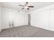 Bedroom with ceiling fan, closet, and attached bathroom at 9118 W Cameron Dr, Peoria, AZ 85345