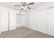 Bedroom with a ceiling fan, closet, and an open doorway at 9118 W Cameron Dr, Peoria, AZ 85345