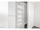 Walk-in closet with built in shelving and hanging rack at 9118 W Cameron Dr, Peoria, AZ 85345