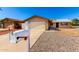Charming single-story home featuring a two-car garage and low-maintenance desert landscaping at 9118 W Cameron Dr, Peoria, AZ 85345