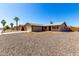Single-story home featuring a two-car garage, desert landscaping, and a well-maintained exterior at 9118 W Cameron Dr, Peoria, AZ 85345