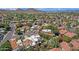 Breathtaking aerial shot of a luxury home in a vibrant community with stunning mountain views and manicured landscapes at 9241 S 50Th St, Phoenix, AZ 85044