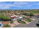 Stunning aerial view showcasing a lovely home with manicured lawns in a desirable community with mountain views at 9241 S 50Th St, Phoenix, AZ 85044