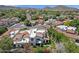 Charming aerial view of homes in a peaceful neighborhood surrounded by mature trees and striking mountain scenery at 9241 S 50Th St, Phoenix, AZ 85044