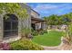 A lush artificial lawn and elegant landscaping enhance this home's backyard at 9241 S 50Th St, Phoenix, AZ 85044