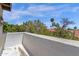 Scenic balcony view showcasing lush greenery, palm trees, and a clear blue sky at 9241 S 50Th St, Phoenix, AZ 85044