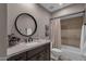 Bathroom featuring a vanity, sink, modern faucet, and a bathtub-shower combination at 9241 S 50Th St, Phoenix, AZ 85044