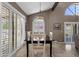 Formal dining room with modern light fixture and sliding glass doors to the patio at 9241 S 50Th St, Phoenix, AZ 85044