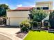 Charming home with manicured landscaping, artificial lawn, and a private two-car garage at 9241 S 50Th St, Phoenix, AZ 85044