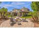 Expansive property showcases outdoor seating, a fire pit, and a rock waterfall at 9241 S 50Th St, Phoenix, AZ 85044