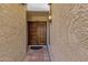 Beautiful double wooden front door under covered entryway with lantern lighting at 9241 S 50Th St, Phoenix, AZ 85044